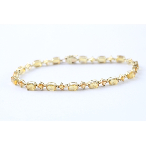 8 - 9ct gold vari-cut citrine station bracelet (5.5g)