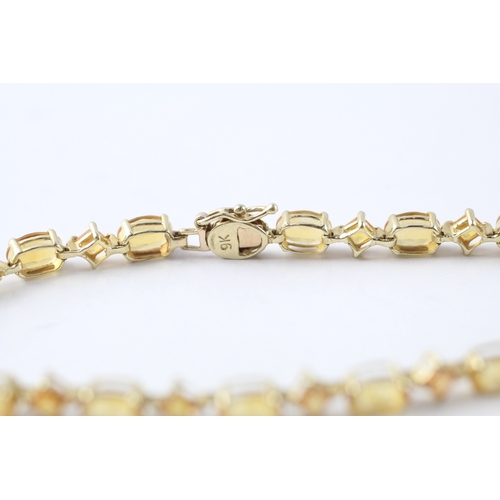 8 - 9ct gold vari-cut citrine station bracelet (5.5g)