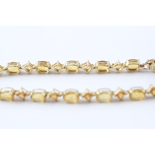 8 - 9ct gold vari-cut citrine station bracelet (5.5g)