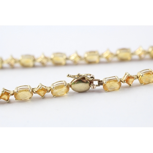 8 - 9ct gold vari-cut citrine station bracelet (5.5g)