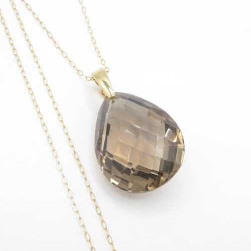 292 - 9ct gold smoky quartz pendant necklace (6.8g)