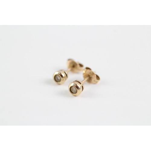 277 - 9ct gold diamond stud earrings (1.1g)