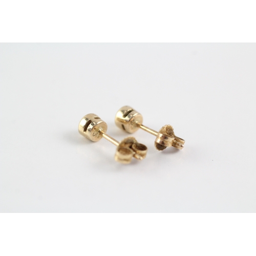 277 - 9ct gold diamond stud earrings (1.1g)