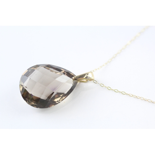 292 - 9ct gold smoky quartz pendant necklace (6.8g)