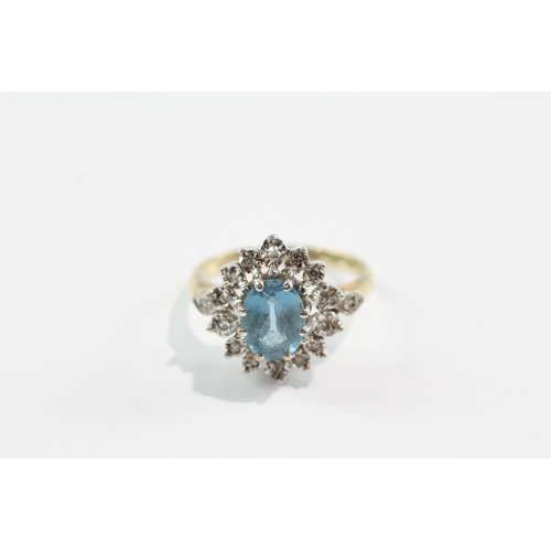 39 - 9ct gold blue topaz diamond cluster ring (3g) Size M