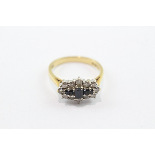 199 - 18ct gold three stone sapphire ring with diamonds (3.8g) Size M