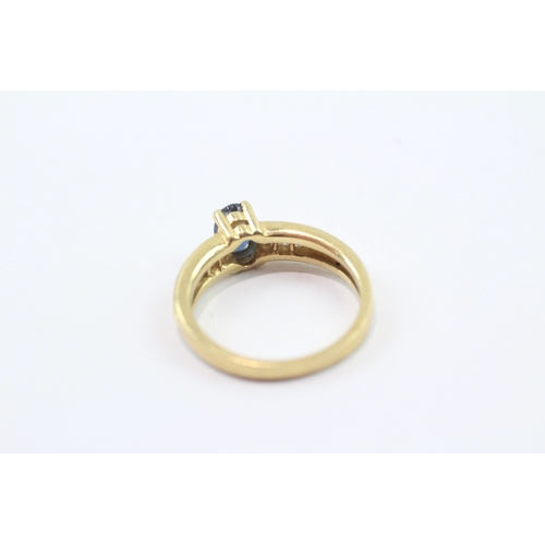 204 - 18ct gold ring with central sapphire and diamond shoulders (3.5g) Size L
