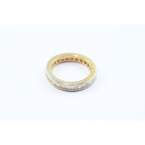 231 - 9ct baguette cut diamond eternity ring (3g) Size K