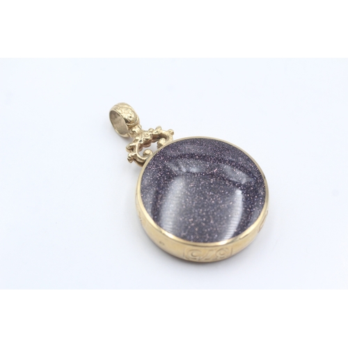 13 - 9ct gold David Scott Walker pendant with onyx and goldstone (22.3g)