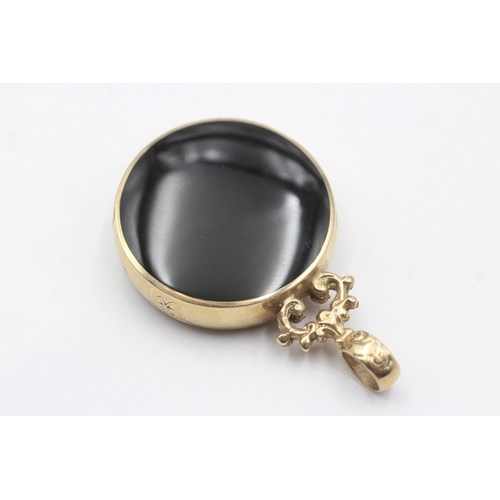 13 - 9ct gold David Scott Walker pendant with onyx and goldstone (22.3g)