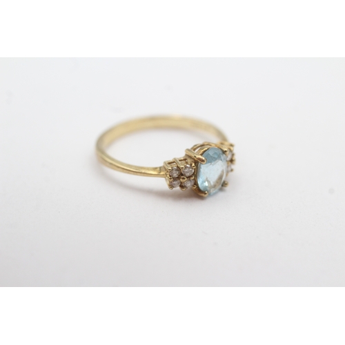 28 - 9ct gold blue topaz diamond ring (1.9g) Size N