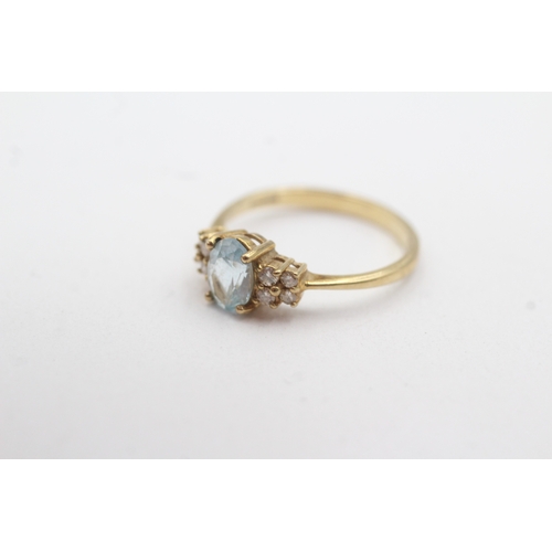 28 - 9ct gold blue topaz diamond ring (1.9g) Size N