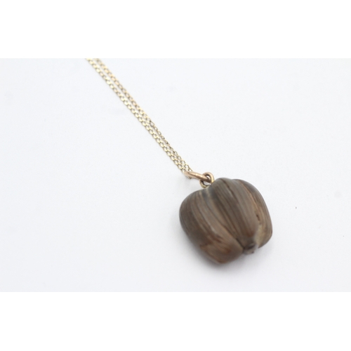 33 - 9ct gold nut pendant necklace (2.4g)