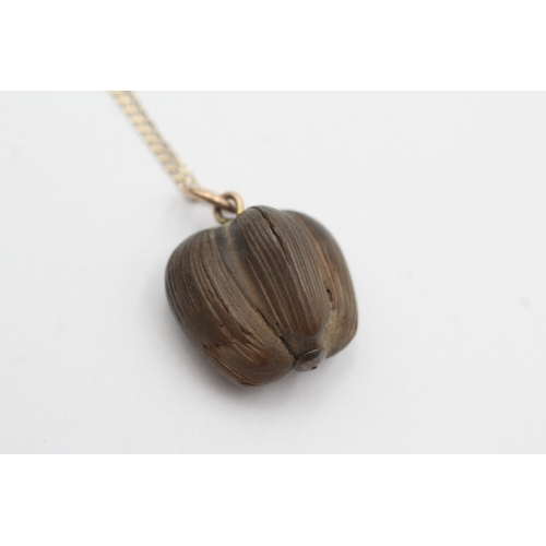 33 - 9ct gold nut pendant necklace (2.4g)