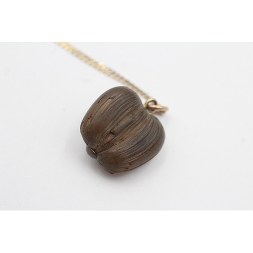 33 - 9ct gold nut pendant necklace (2.4g)