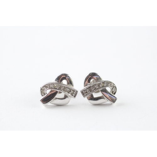53 - 9ct white gold diamond stud earrings (2.1g)