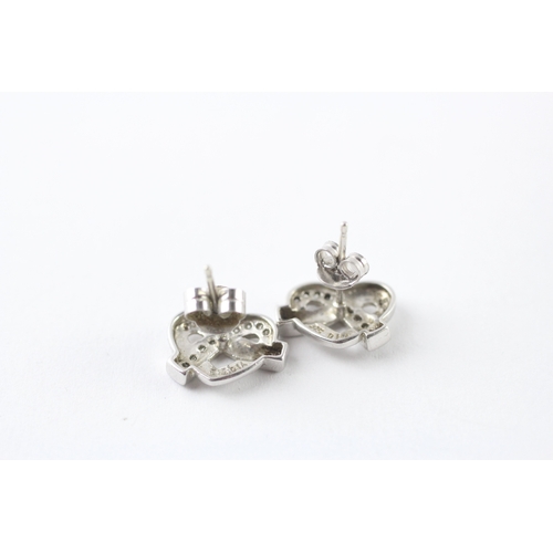 53 - 9ct white gold diamond stud earrings (2.1g)