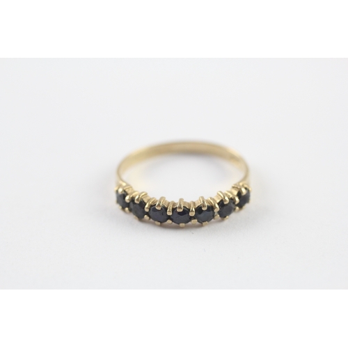 57 - 9ct gold sapphire half eternity ring (1.4g) Size N