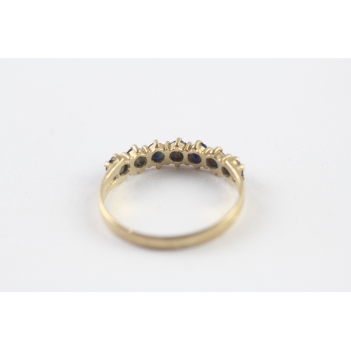 57 - 9ct gold sapphire half eternity ring (1.4g) Size N