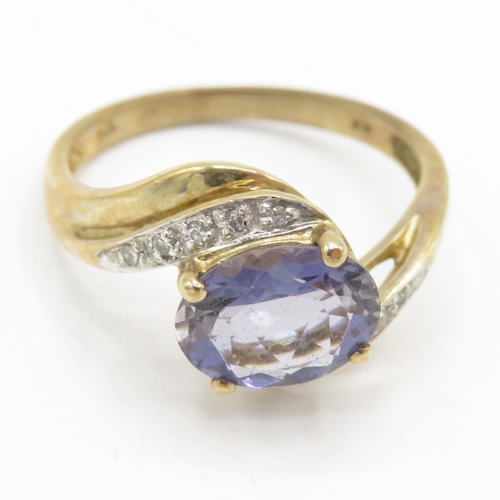 198 - 9ct gold iolite & diamond dress ring (2.6g) Size O 1/2