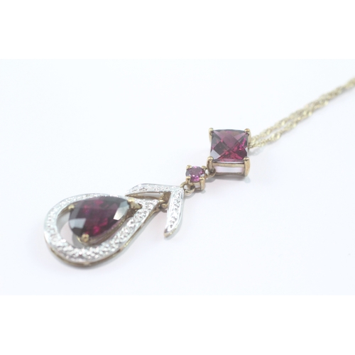 197 - 9ct gold garnet and diamond pendant on chain (3.5g)