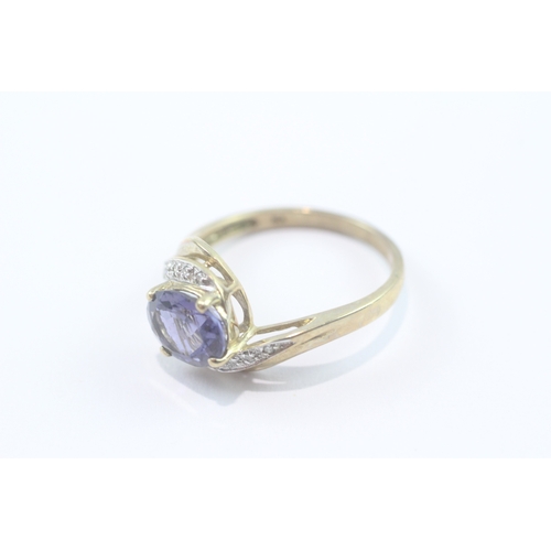 198 - 9ct gold iolite & diamond dress ring (2.6g) Size O 1/2