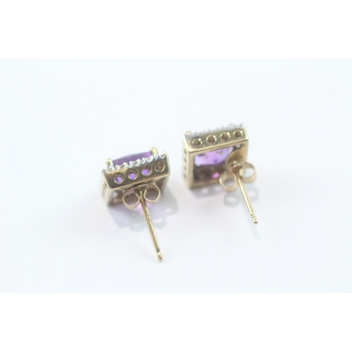 214 - 9ct gold amethyst and diamond stud earrings (2.2g)