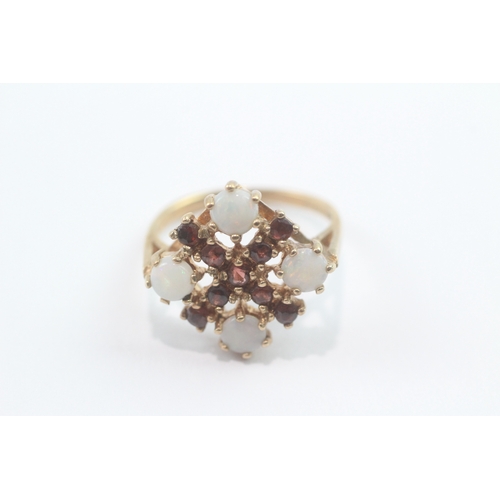218 - 9ct gold opal garnet cocktail ring (3.4g) Size L