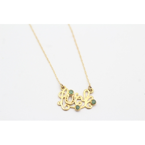 54 - 9ct gold emerald 'luck' pendant necklace (1.4g)