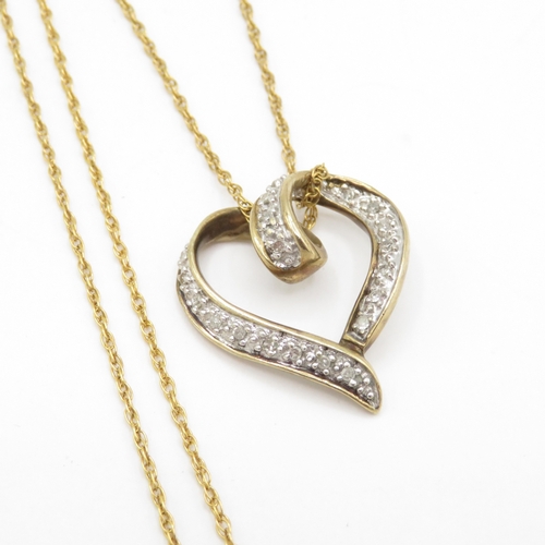 124 - 9ct gold diamond heart pendant necklace (3.2g)