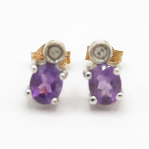 157 - 9ct gold amethyst diamond stud earrings (1.3g)