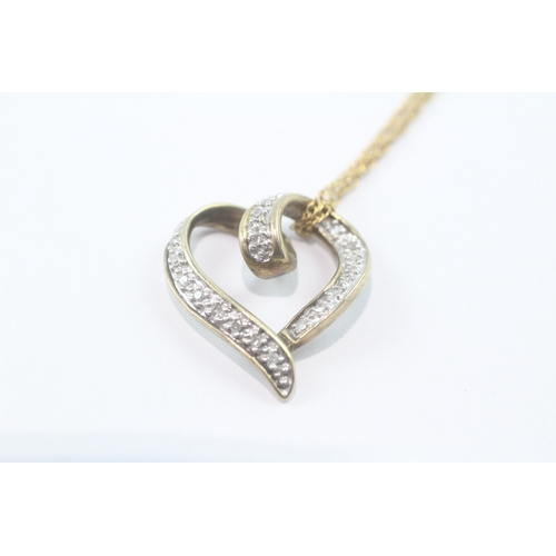 124 - 9ct gold diamond heart pendant necklace (3.2g)