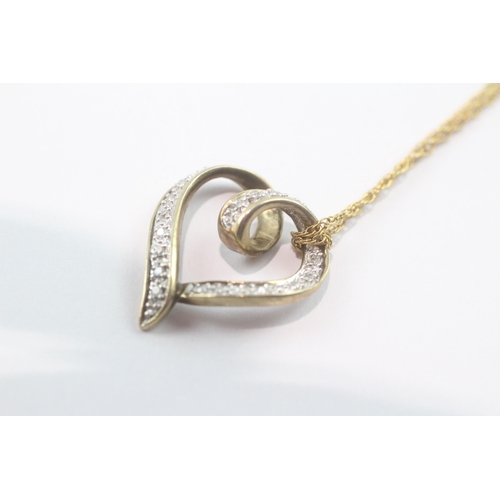 124 - 9ct gold diamond heart pendant necklace (3.2g)
