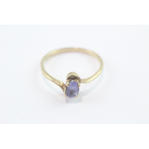 152 - 9ct gold tanzanite crossover ring (1.7g) Size P