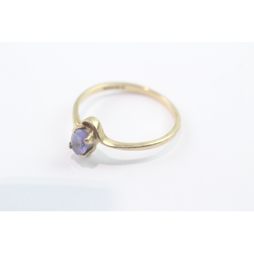 152 - 9ct gold tanzanite crossover ring (1.7g) Size P