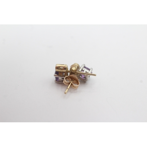 157 - 9ct gold amethyst diamond stud earrings (1.3g)