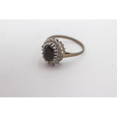 158 - 9ct gold diamond and sapphire cluster ring (2.2g) Size K 1/2