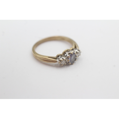 163 - 9ct gold tanzanite diamond trilogy ring (2.3g) Size L