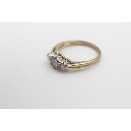 163 - 9ct gold tanzanite diamond trilogy ring (2.3g) Size L