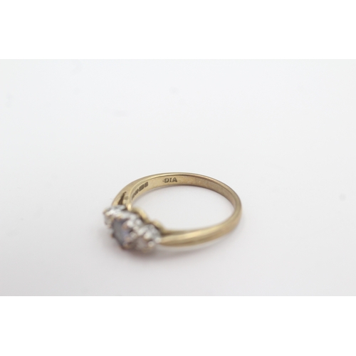163 - 9ct gold tanzanite diamond trilogy ring (2.3g) Size L