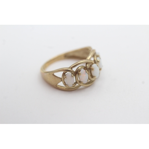 164 - 9ct gold opal five-stone ring (2.6g) Size N