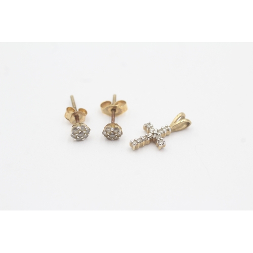 165 - 2x 9ct gold diamond cross pendant stud earrings with later added backs (1.3g)