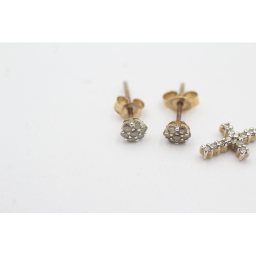 165 - 2x 9ct gold diamond cross pendant stud earrings with later added backs (1.3g)