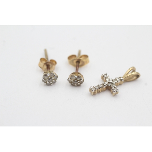 165 - 2x 9ct gold diamond cross pendant stud earrings with later added backs (1.3g)