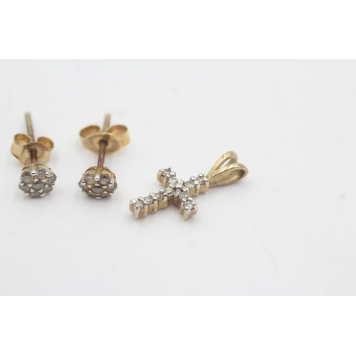 165 - 2x 9ct gold diamond cross pendant stud earrings with later added backs (1.3g)