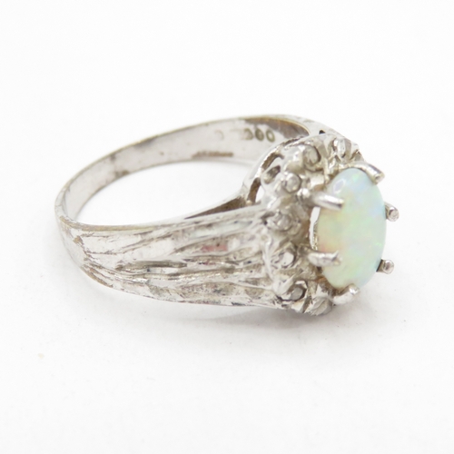 107 - 9ct white gold opal and diamond halo ring (2.6g) Size L