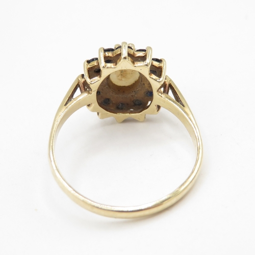 109 - 9ct gold opal and sapphire halo dress ring  (3.1g) Size R