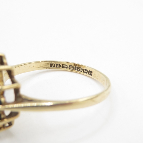 109 - 9ct gold opal and sapphire halo dress ring  (3.1g) Size R