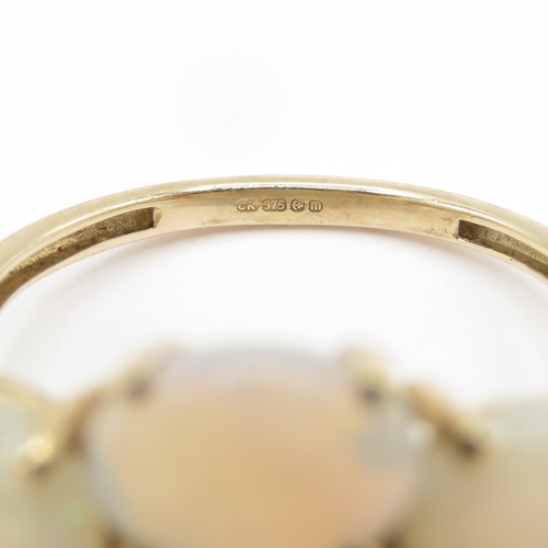 121 - 9ct gold opal diamond dress ring  (2.8g) Size N