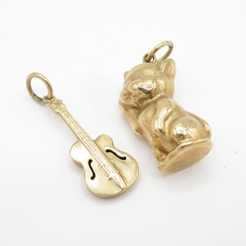 122 - 2 x 9ct gold charms - cat and guitar (1.8g)